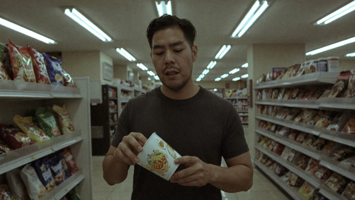 Alain picking a NOMI cup off the shelf